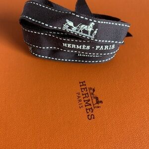 Hermès Paris Black Ribbon on Orange Background